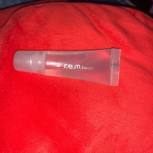 R.E.M Beauty upmost importance plumping lip gloss